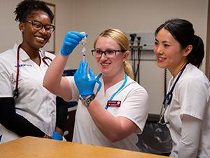 nursing students preparing needle